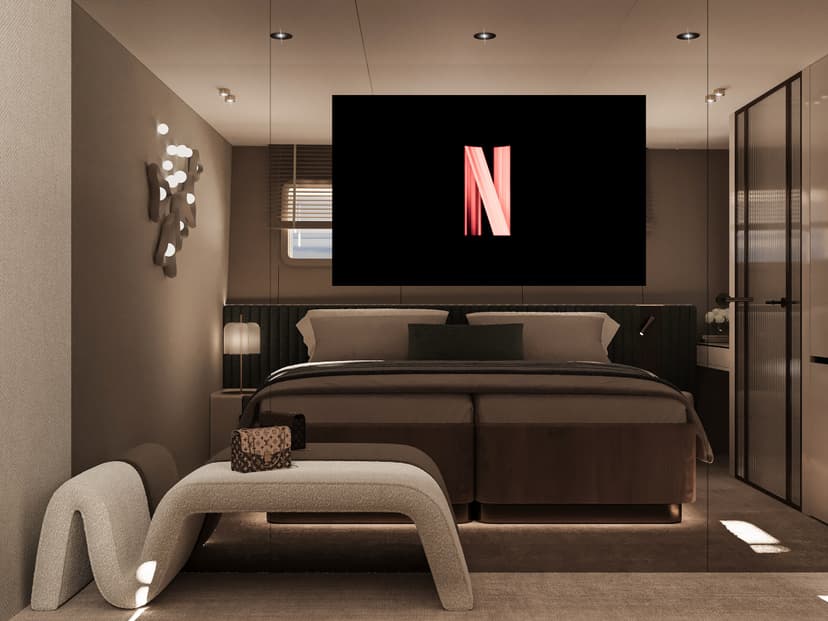 Luxury guest cabin bedroom with large bed and TV screen