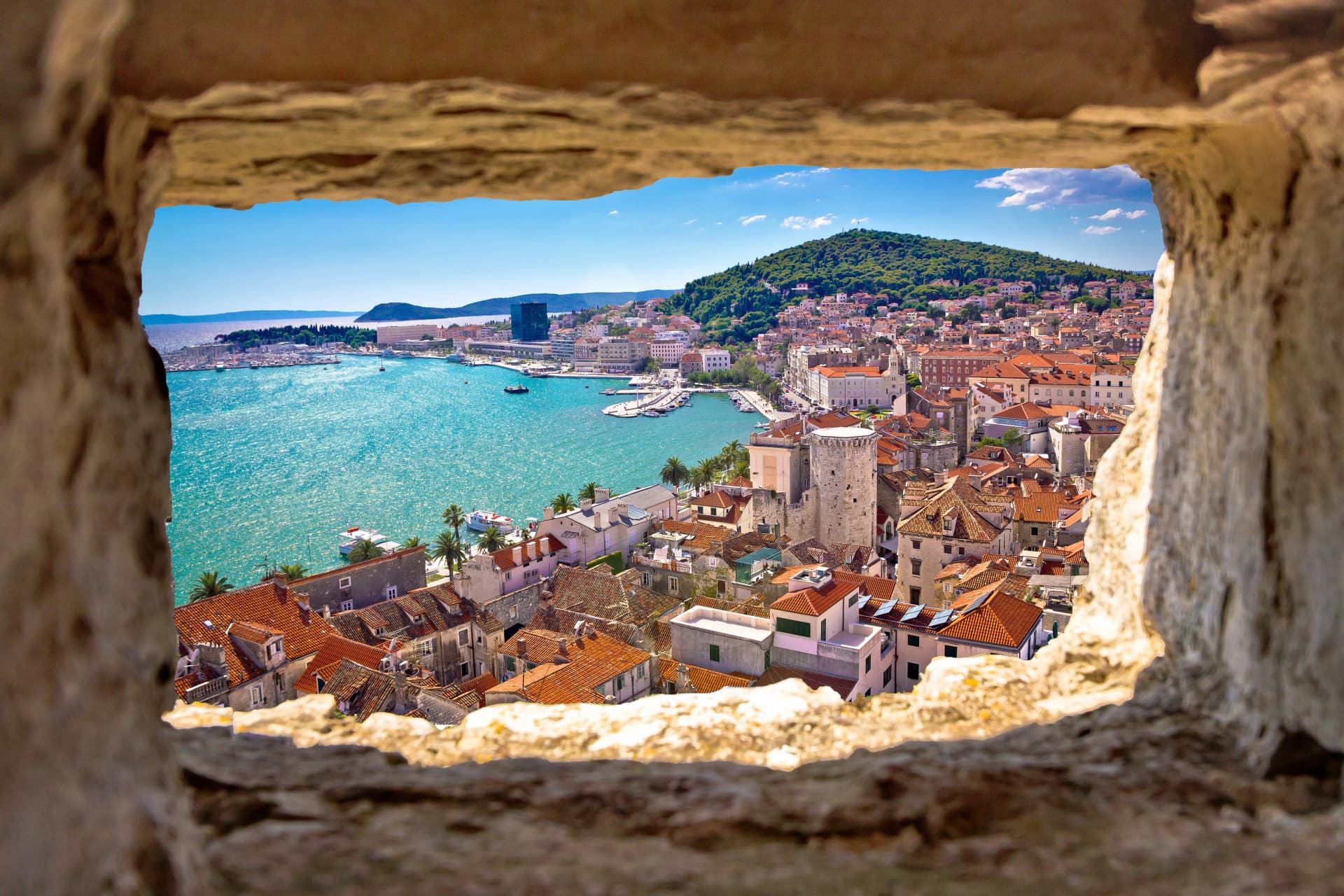 Split bay aerial view through stone window