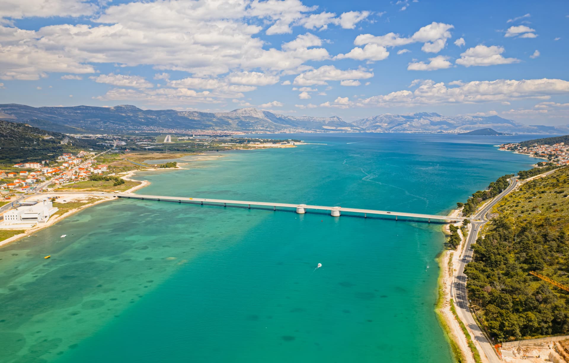 Aerial top view of a long bridge above a sea, island Ciovo in Croatia