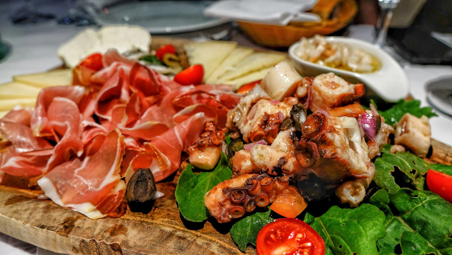 Traditional Croatian spread with prsut and octopus. Croatian ham (prsut) and octopus mezze