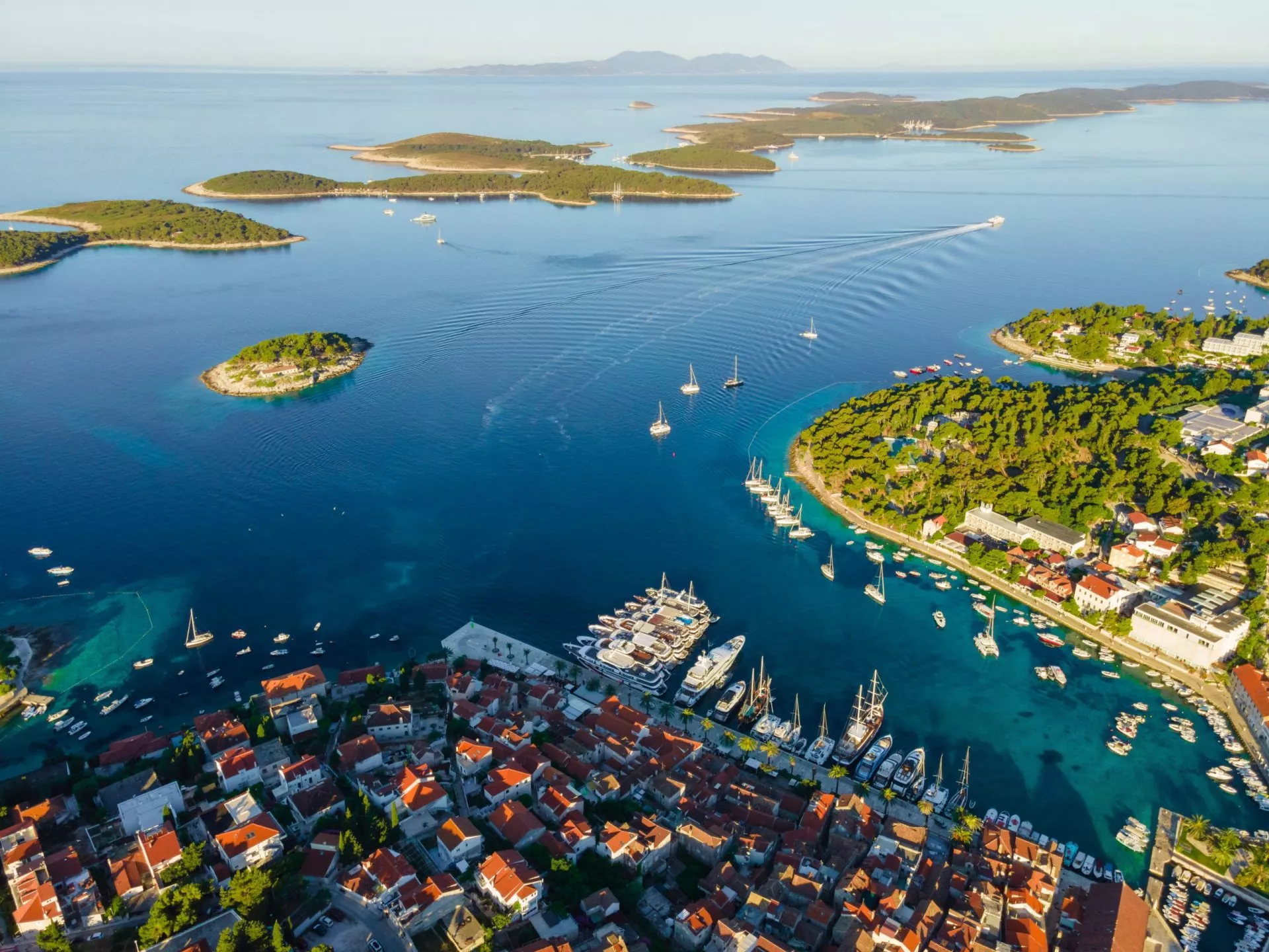 Aerial view old town hvar with turquoise water bay with yachts islands croatia